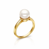 Elegant gold pearl ring close-up